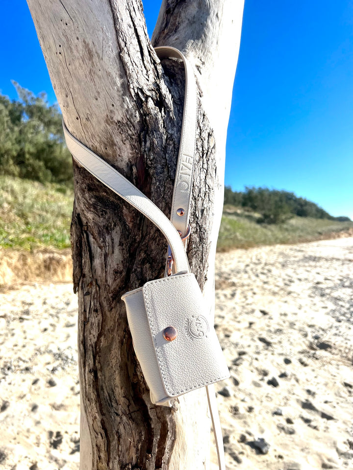 Halo Pet Crystal Royal Beige Off White Leash and Poop Bag Holder at the beach